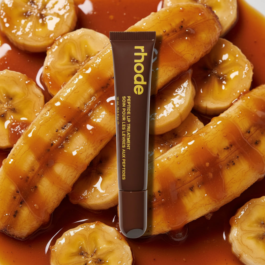 Brown lip balm tube with 'rhode' branding on a white background